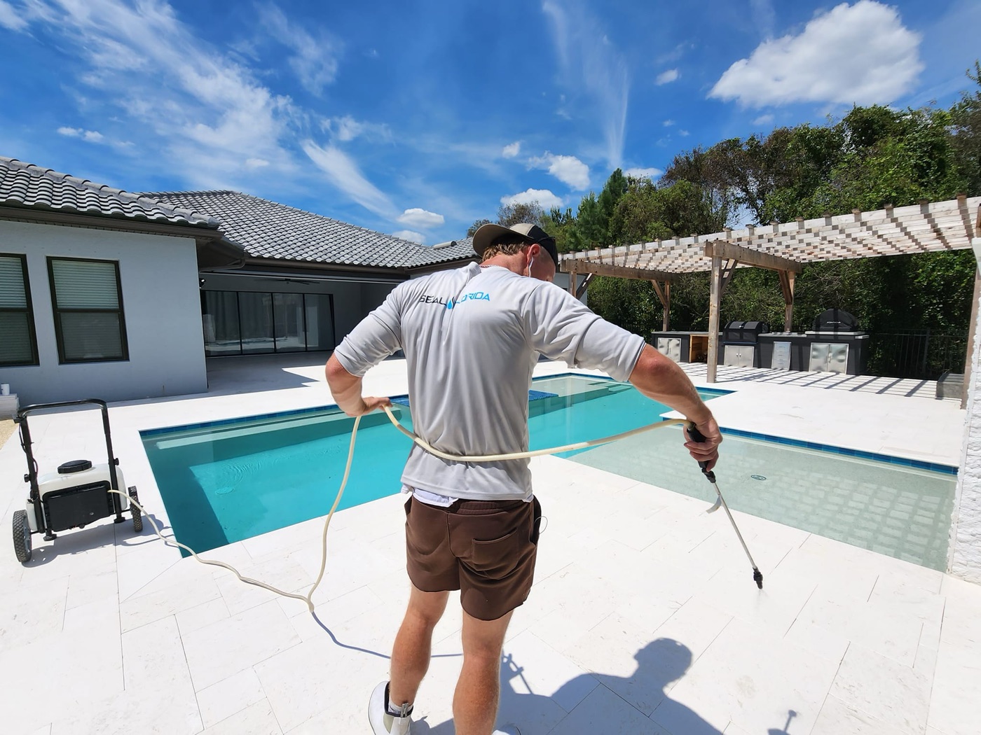 Seal Florida crew sealing a natural stone pool deck