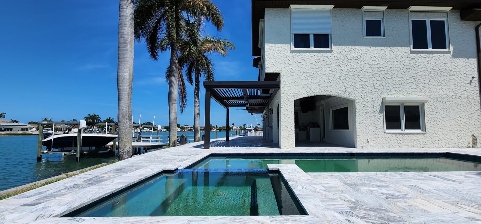 Waterfront property with a professionally sealed paver deck